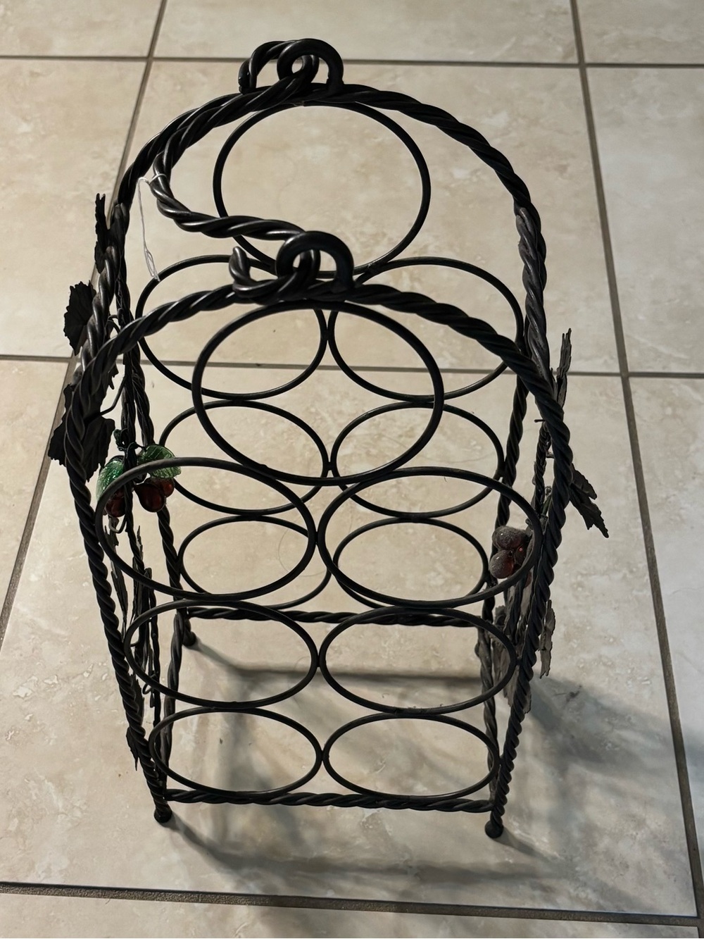 Black Metal Wine Bottle Rack with Decorative Leaf Accents
